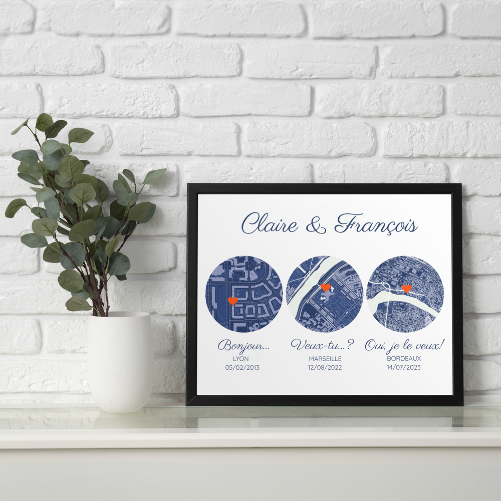 Affiche aux trois cartes bleues dans un cadre noir contre un mur de briques blanches, cadeau pour les mariés